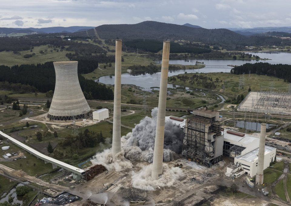 Explosives topple giant chimneys at defunct NSW power plant
